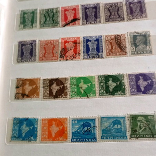 Two stamp albums with stamps from around the world
