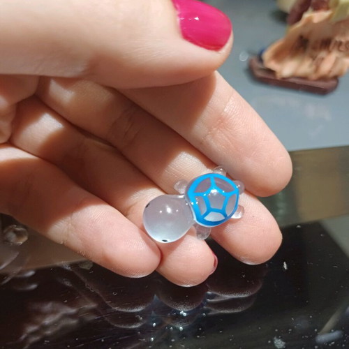 Glowing turtle new, blue, glass-like or hard plastic material