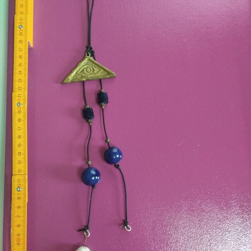 Hanging wall eye charm used with bronze eye