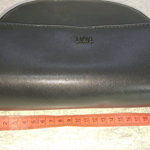 Dkny black leather crossbody bag like new with knot design strap