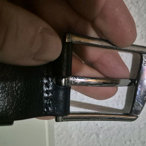 Simple metal belt buckle with prong and leather loop like new