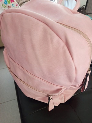 Pink school backpack used with zipper and compartments