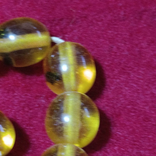 Worry beads with insects inside beads, unknown material