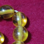 Worry beads with insects inside beads, unknown material