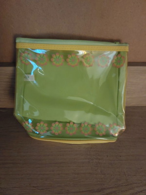 Transparent toiletry bag new with green interior and yellow back