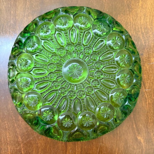 Green vintage glass plate used with embossed mid century design
