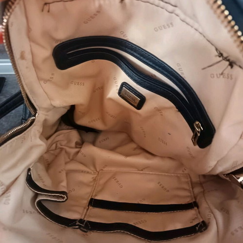 Guess backpack used with leather cracks