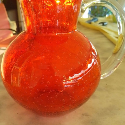 Vintage glass pitcher with handle, orange color, new