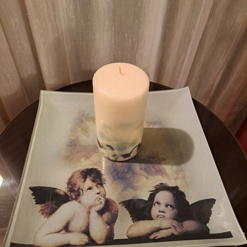 Plate with angels and used candle