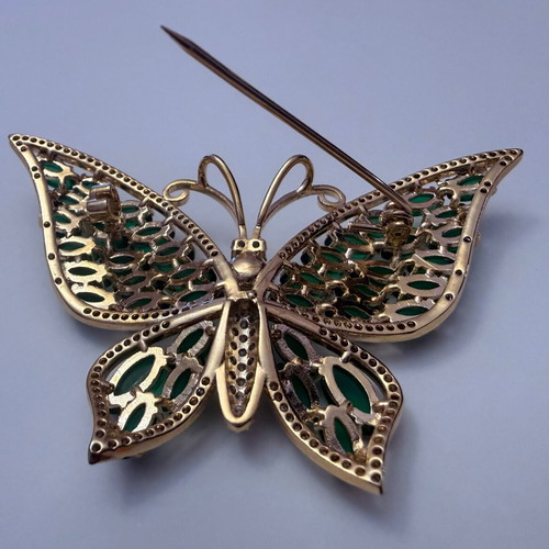Vintage butterfly brooch with green cabochon stones and white zircon, like new