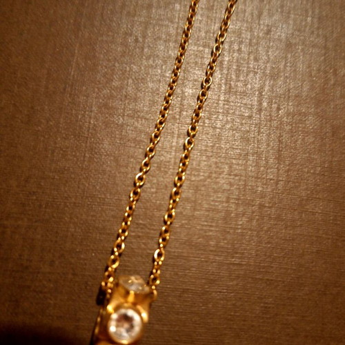 Folli Follie necklace like new, gold color with barrel and stones