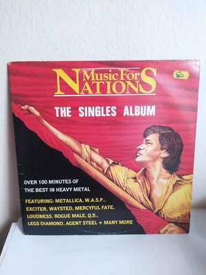The Singles Album double vinyl used, heavy metal