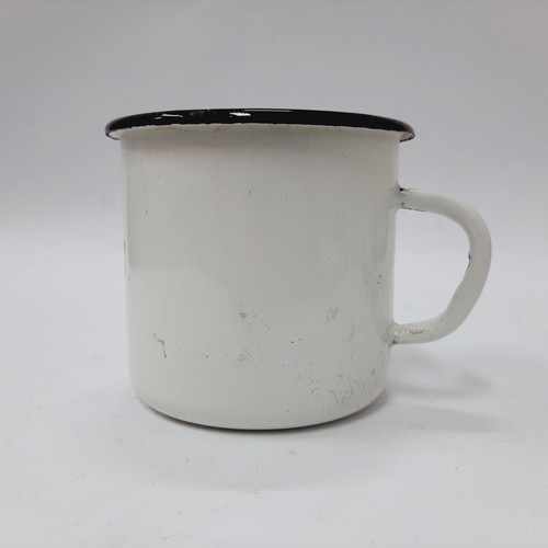 Vintage enamel metal mug with floral motif