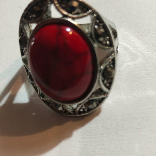 Silver-plated ring with red stone and small crystals new