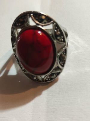 Silver-plated ring with red stone and small crystals new