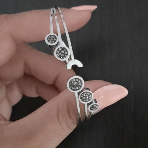Rigide Stainless Steel bracelet like new with black and grey zirconia circles