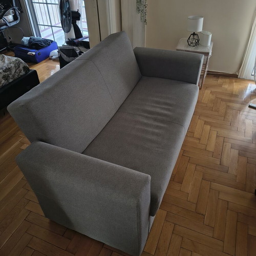 Two-seater sofa with storage and bed function