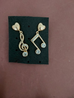 Gold-tone music note earrings with rhinestones and heart