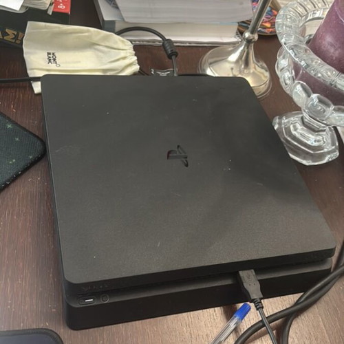 Sony PS4 Slim 1TB console with DualShock 4 controller
