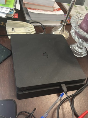 Sony PS4 Slim 1TB console with DualShock 4 controller