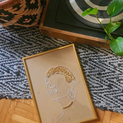 Handmade frame new with female face and golden beads