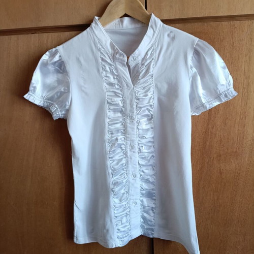 White blouse with satin ruffles and decorative crystal buttons, like new