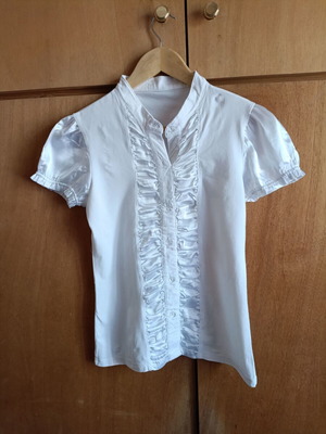 White blouse with satin ruffles and decorative crystal buttons, like new