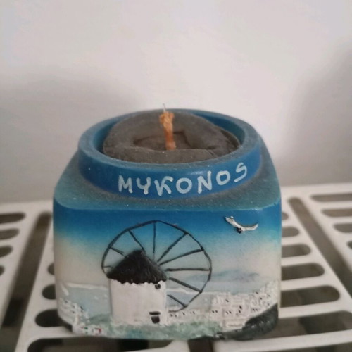 Mykonos decorative candle like new with clay holder and carved relief