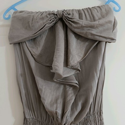 Strapless jumpsuit used, gray brown with bow and ruffles