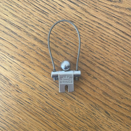 Prince vintage collectible metal keychain used, silver color