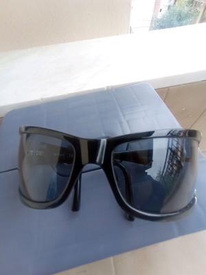 Vogue sunglasses used, black with scratch on lens