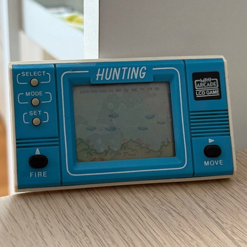 Mini retro arcade handheld console used without cover