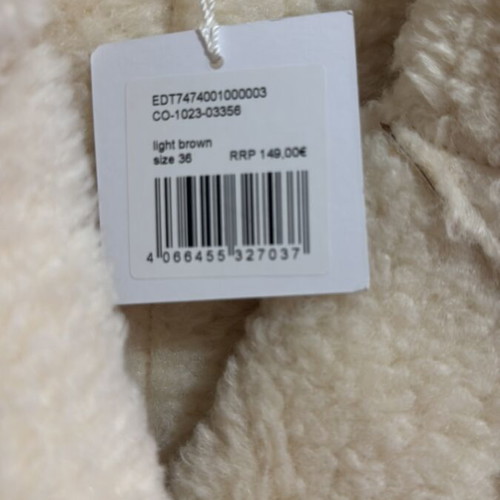 Edited beige coat with fur lining, new with tags