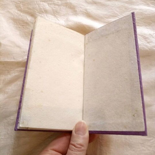 Decorative notepad with index used, purple, natural paper