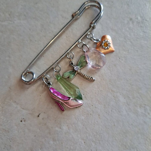 Pin with dangling charms like new