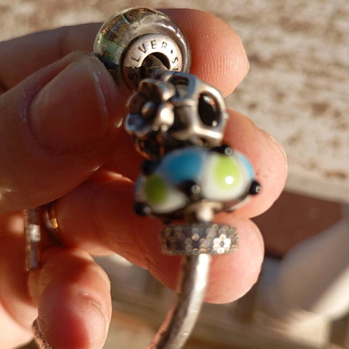 Hammered silver bracelet with Murano charms like new