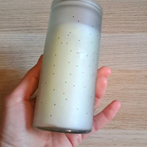 White candle in container new