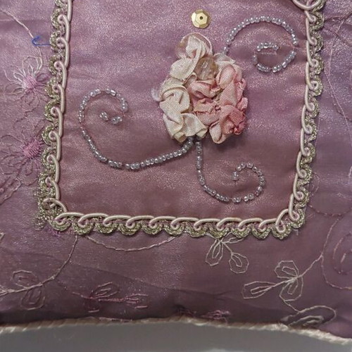 Vintage decorative pillow used with embroidery and embossed flowers