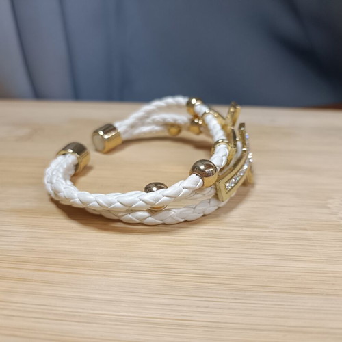 White and gold women's bracelet with rhinestones