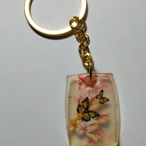Handmade butterfly keychain from resin like new, white multicolor