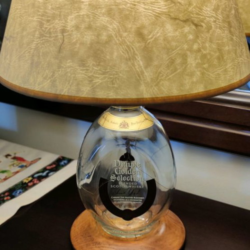 Dimple Golden Selection lamp used with handmade papyrus shade and wooden base