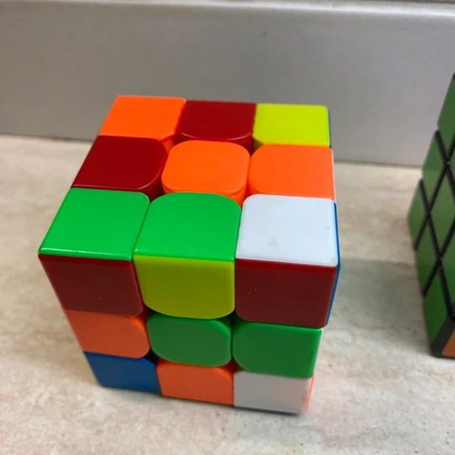 Set of 4 cubes like new, including 3x3, 3x3 mini, and 2x1