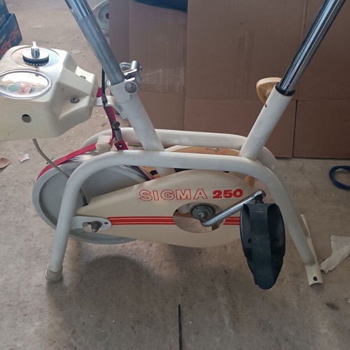 Stationary Exercise Bike used, 1990s model with adjustable resistance