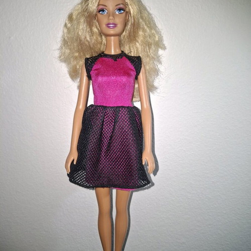 Barbie doll used with original dress and necklace
