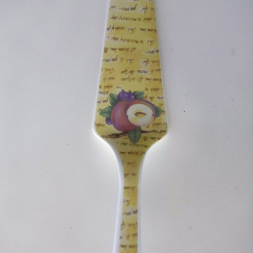 Ceramic serving platter with matching spatula, fruit design