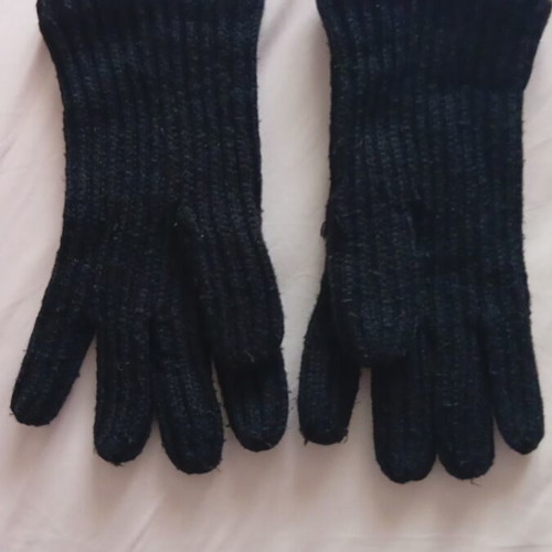Black rib-knit gloves used with embroidered Gemini symbol