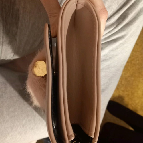 Pink clutch used with chain and slight wear