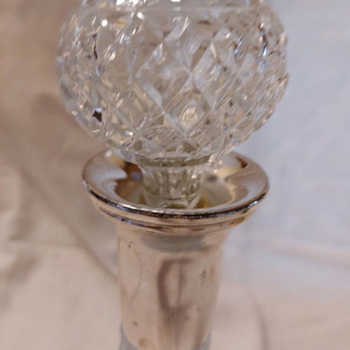 Crystal wine bottle used with silver-plated neck and stopper