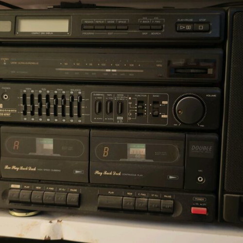 Booster stereo system used, 90s style, removable speakers