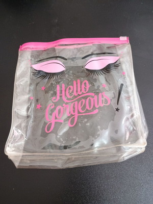 Transparent pink toiletry bag used
